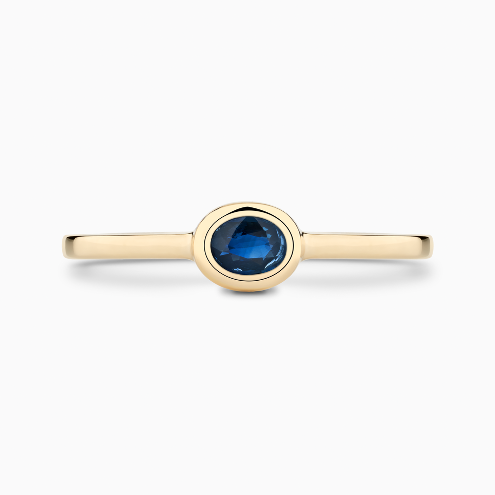 The Ecksand Oval-Cut Blue Sapphire Stackable Ring shown with  in 14k Yellow Gold
