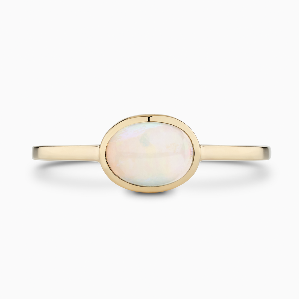 The Ecksand Oval-Cut Opal Stackable Ring shown with  in 14k Yellow Gold