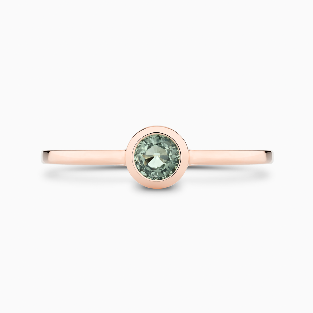 The Ecksand Round-Cut Montana Green Sapphire Stackable Ring shown with  in 14k Rose Gold