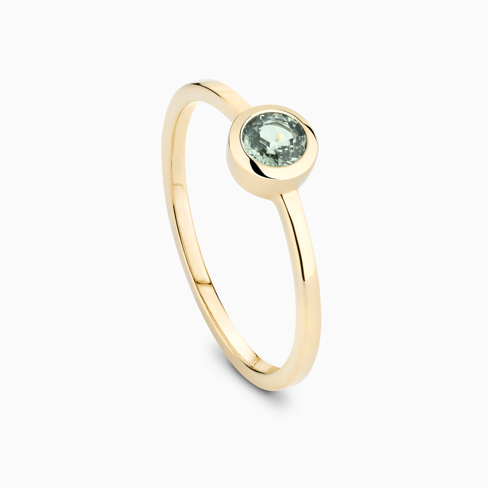 The Ecksand Round-Cut Montana Green Sapphire Stackable Ring shown with  in 
