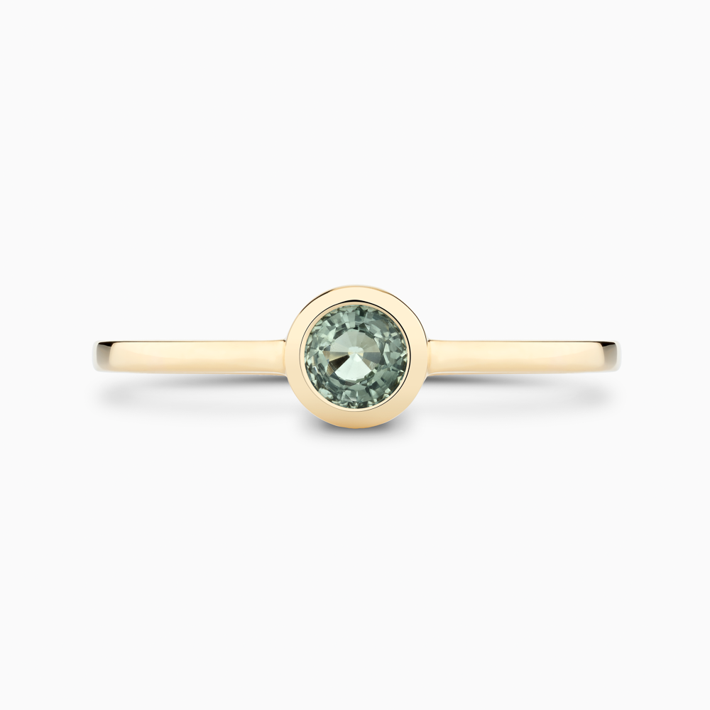The Ecksand Round-Cut Montana Green Sapphire Stackable Ring shown with  in 14k Yellow Gold