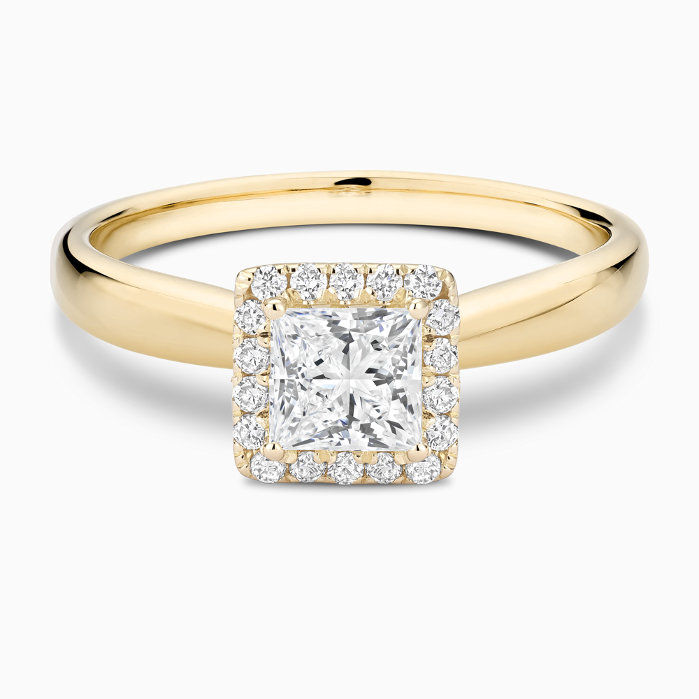 The Ecksand Secret Heart Engagement Ring with Halo shown with Princess in 18k Yellow Gold