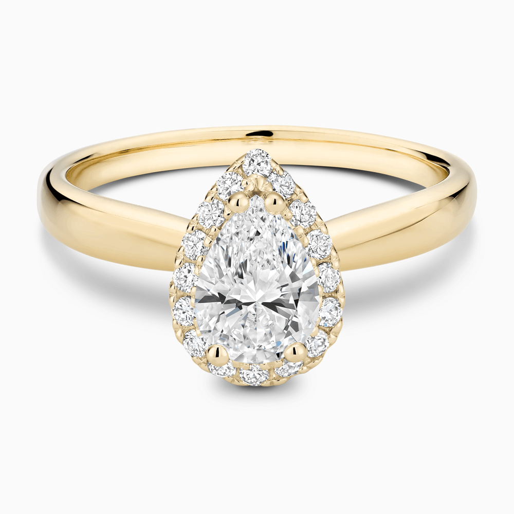 The Ecksand Secret Heart Engagement Ring with Halo shown with Pear in 18k Yellow Gold