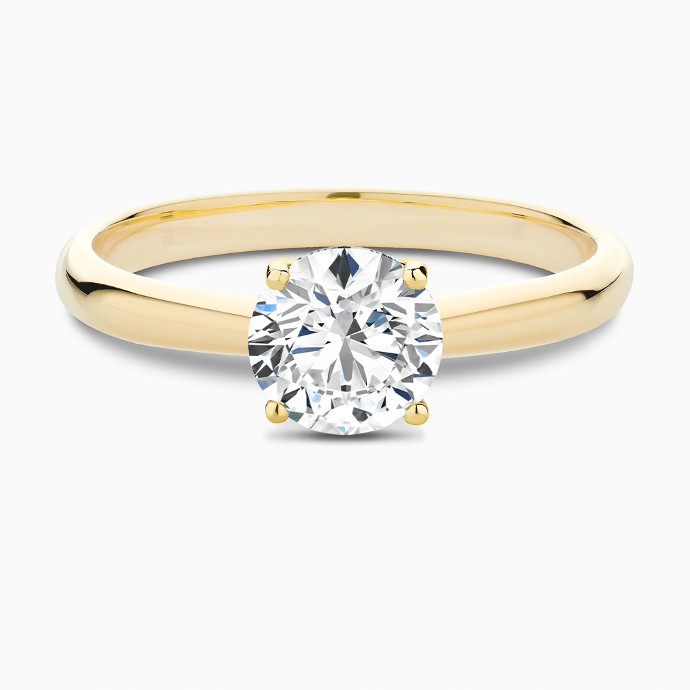 The Ecksand Tapered Diamond Engagement Ring with Basket Setting shown with Round in 18k Yellow Gold