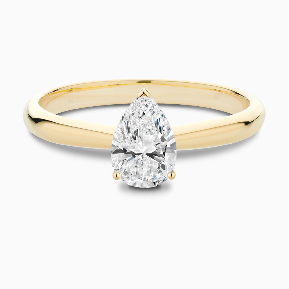 The Ecksand Tapered Diamond Engagement Ring with Basket Setting shown with Pear in 18k Yellow Gold