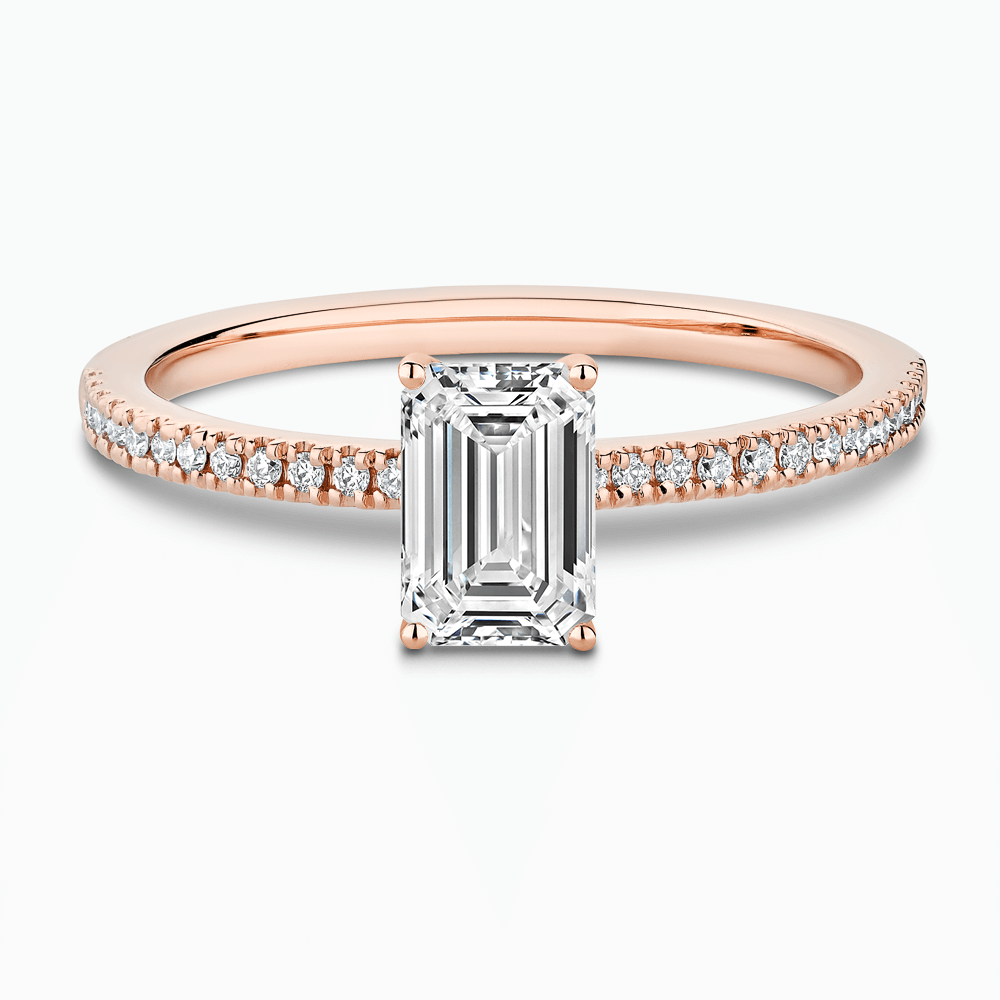 The Ecksand Four-Prong Diamond Engagement Ring with Diamond Pavé shown with Emerald in 14k Rose Gold