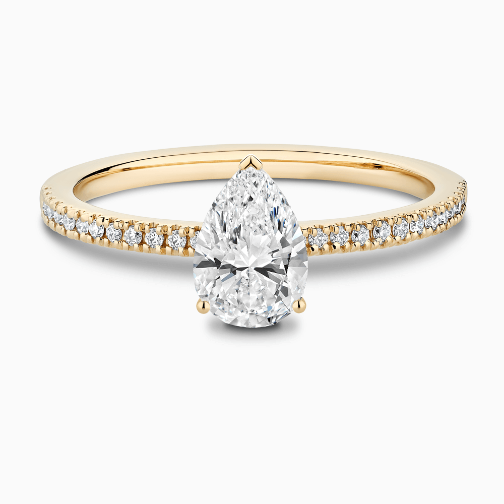 The Ecksand Four-Prong Diamond Engagement Ring with Diamond Pavé shown with Pear in 18k Yellow Gold