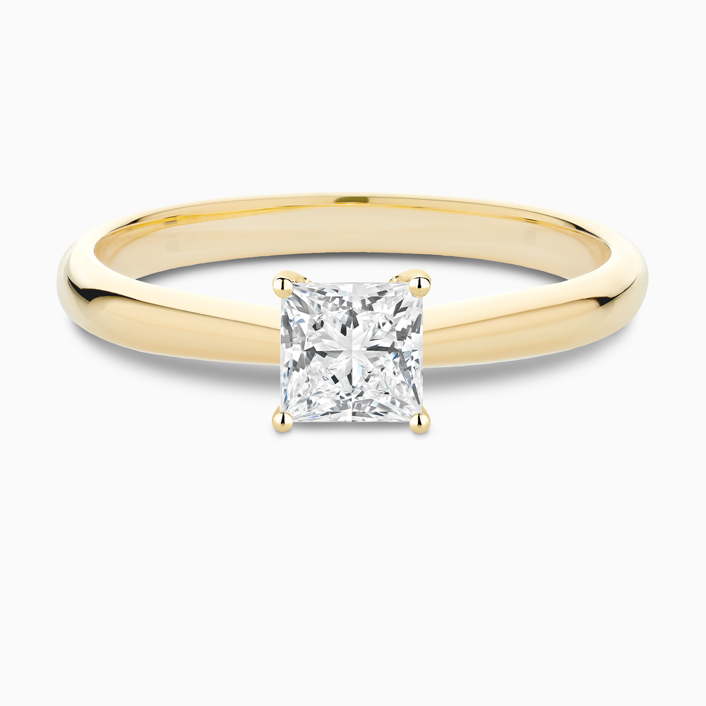 The Ecksand Tapered Diamond Engagement Ring with Basket Setting shown with Princess in 18k Yellow Gold