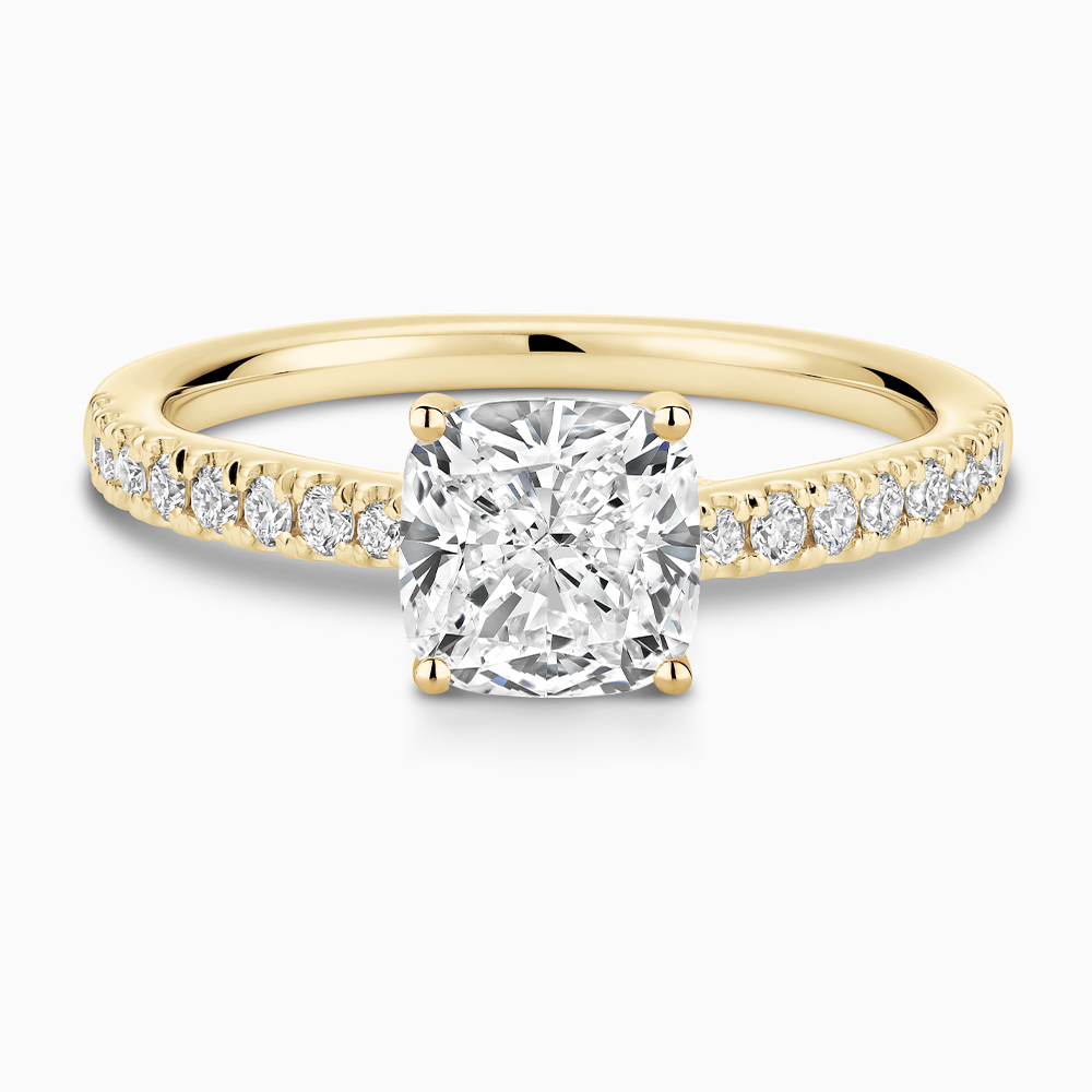 The Ecksand Thick Diamond Engagement Ring with Secret Heart and Diamond Band shown with Cushion in 18k Yellow Gold