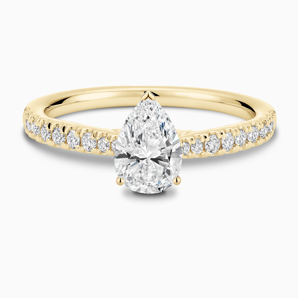 The Ecksand Thick Diamond Engagement Ring with Secret Heart and Diamond Band shown with Pear in 18k Yellow Gold