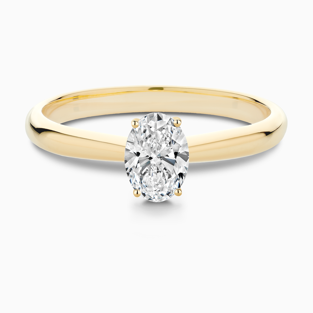 The Ecksand Tapered Diamond Engagement Ring with Basket Setting shown with Oval in 18k Yellow Gold