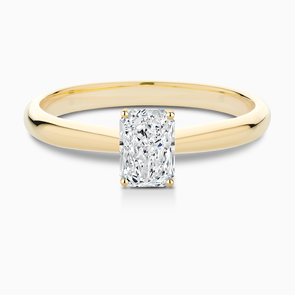 The Ecksand Tapered Diamond Engagement Ring with Basket Setting shown with Radiant in 18k Yellow Gold