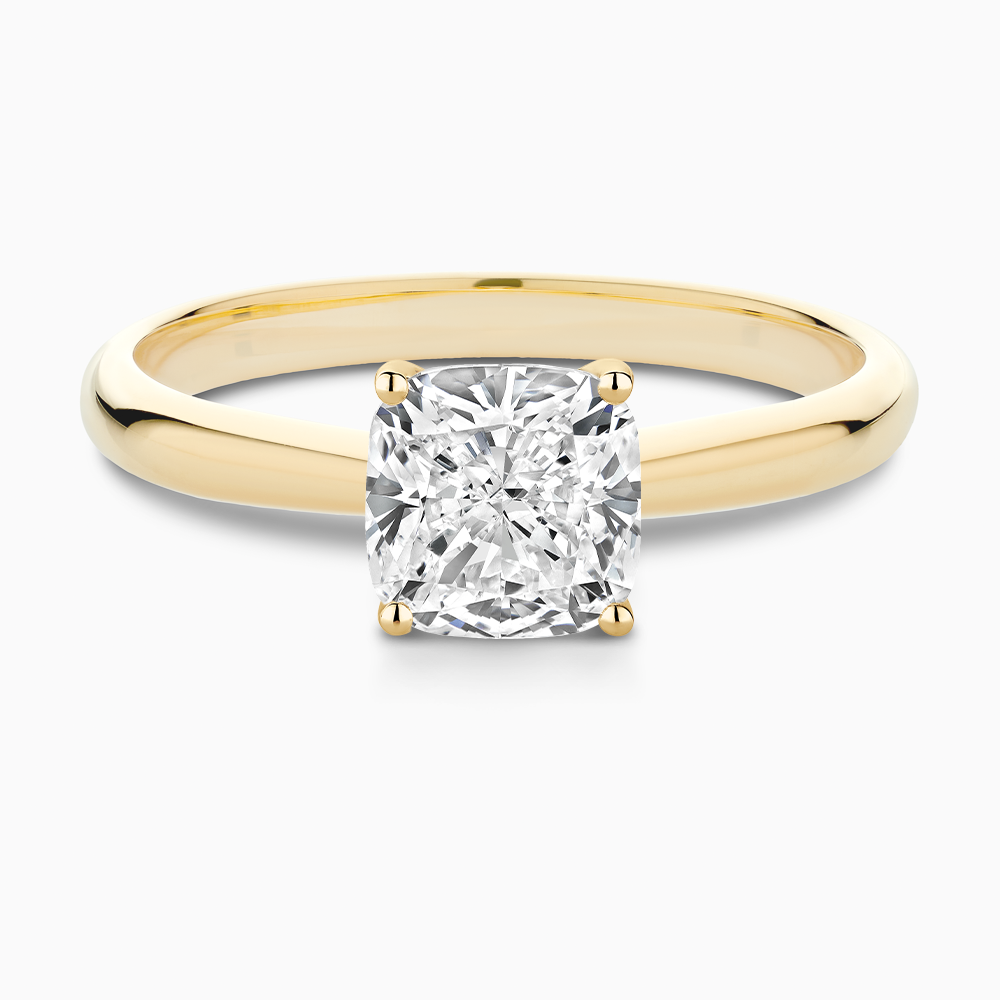The Ecksand Tapered Diamond Engagement Ring with Basket Setting shown with Cushion in 18k Yellow Gold