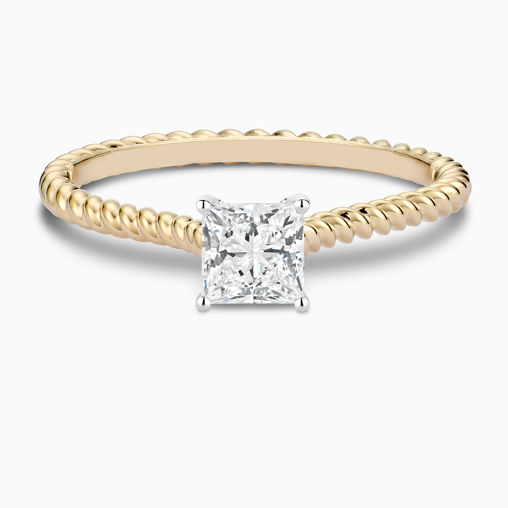 The Ecksand Twisted Diamond Solitaire Engagement Ring shown with Princess in 18k Yellow Gold