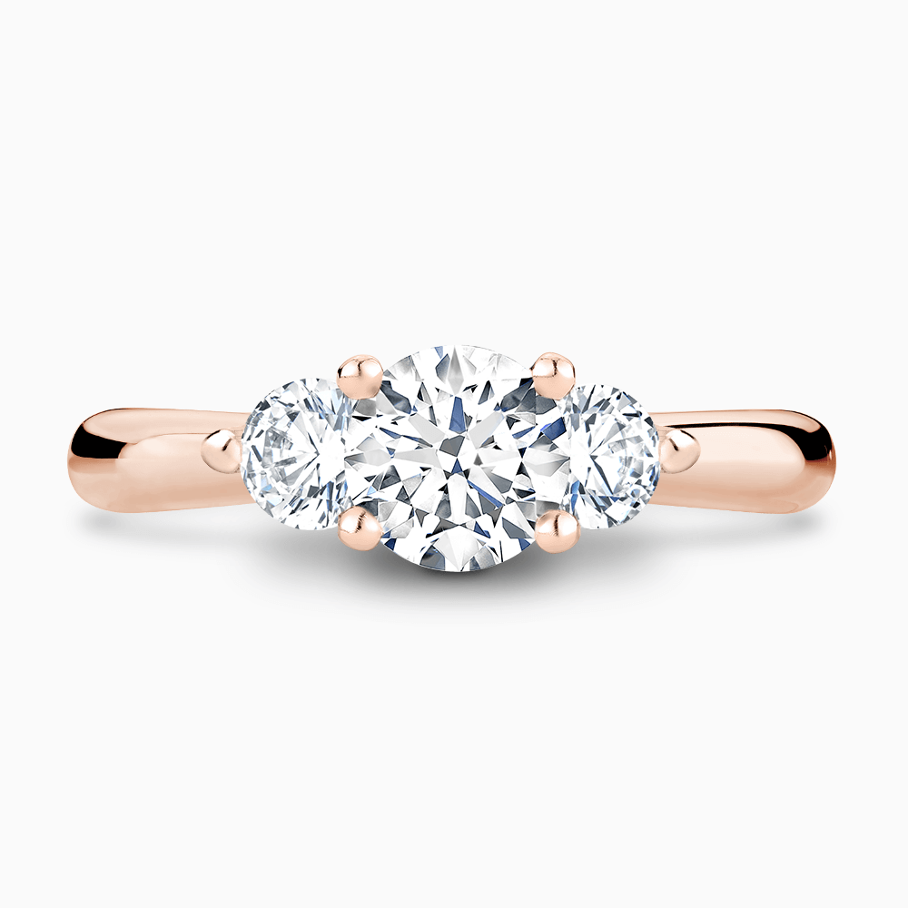 The Ecksand Three-Stone Diamond Engagement Ring with Twisted Prong Setting shown with Round in 14k Rose Gold