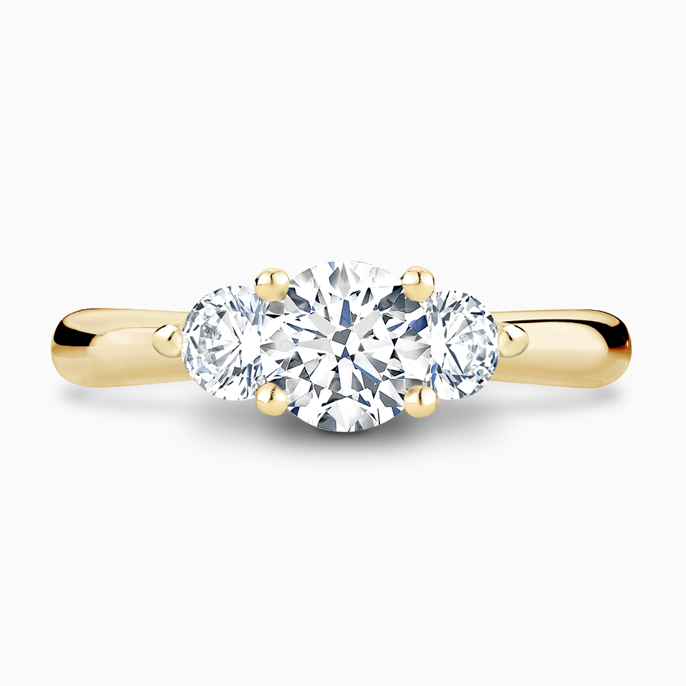 The Ecksand Three-Stone Diamond Engagement Ring with Twisted Prong Setting shown with Round in 18k Yellow Gold
