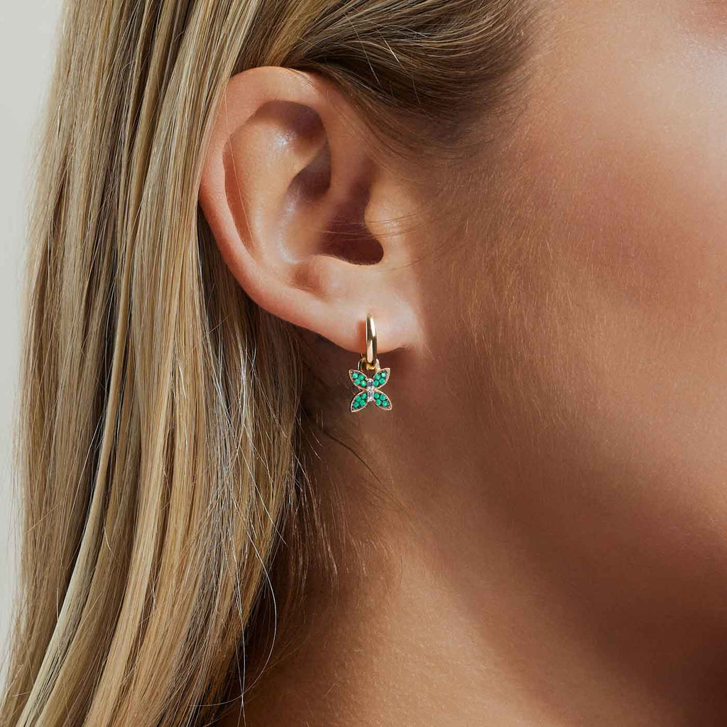 The Ecksand Butterfly Dangle Earrings with Accent Emeralds and Diamonds shown with  in 