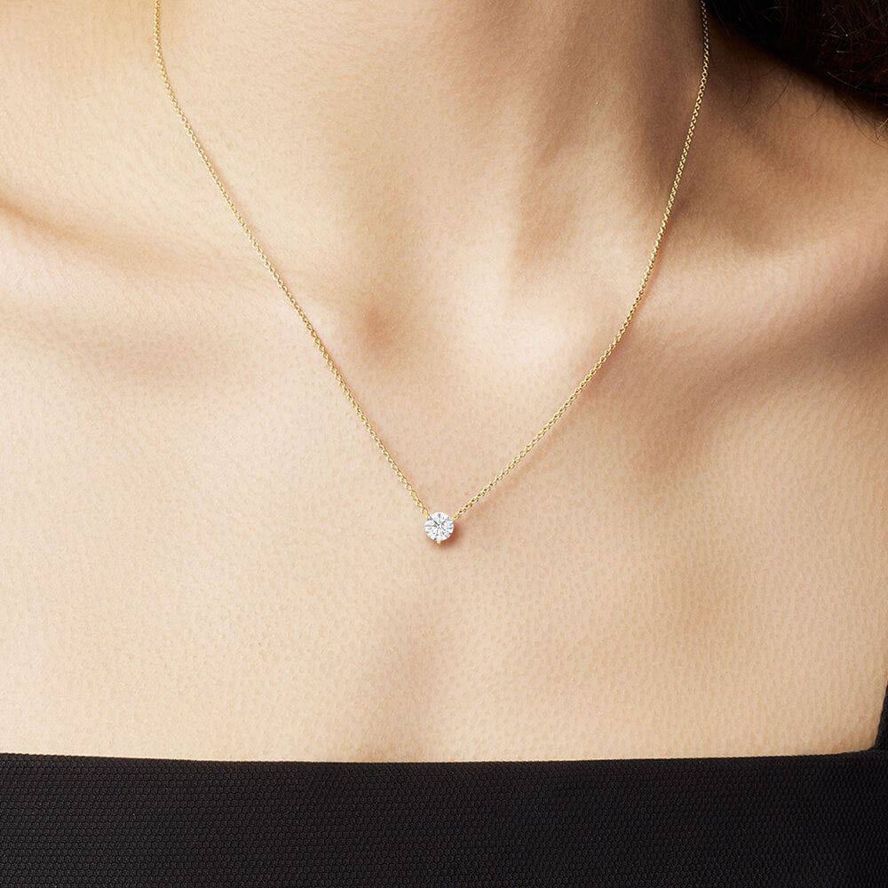 The Ecksand Solitaire Diamond Necklace shown with  in 