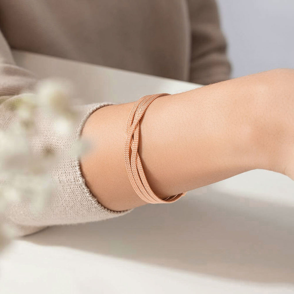 The Ecksand Twisted Gold Bangle shown with  in 