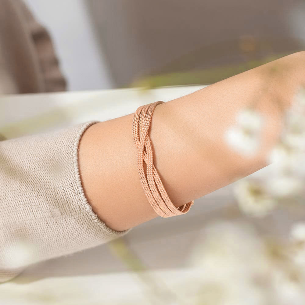 The Ecksand Twisted Gold Bangle shown with  in 
