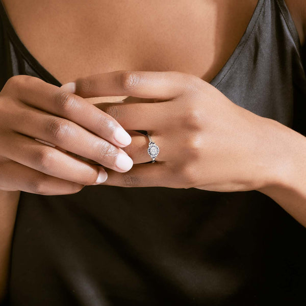 Engagement ring with 2025 sapphire under diamond