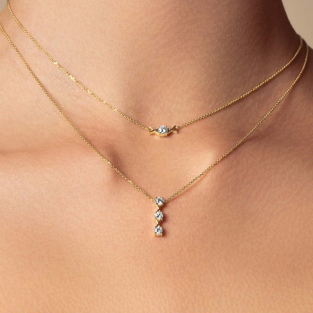 The Ecksand Interlocking X's Diamond Solitaire Necklace shown with  in 